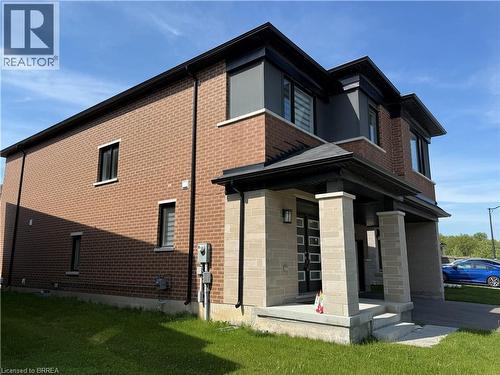 Contemporary two-story residence featuring a brick facade with dark window trim and black eaves - 18 Dolucci Crescent, Brampton, ON - Outdoor With Exterior