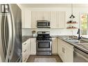 1209 Bergamot Avenue, Kelowna, BC  - Indoor Photo Showing Kitchen With Double Sink 