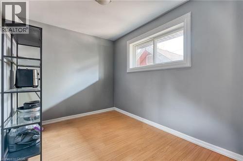 Interior room featuring light gray walls, wood-finish flooring, and white baseboards - 151 Winchester Boulevard, Hamilton, ON - Indoor Photo Showing Other Room