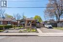 Brick facade residence with a covered front porch featuring wood-look posts and a stone base - 151 Winchester Boulevard, Hamilton, ON  - Outdoor With Facade 