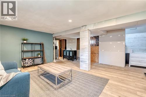 Open concept living space featuring recessed lighting, wood-finish flooring, and a decorative column with horizontal paneling - 151 Winchester Boulevard, Hamilton, ON - Indoor