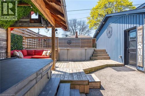Expansive outdoor space featuring a covered pergola, a hot tub, and a multi-level wood-finish deck - 151 Winchester Boulevard, Hamilton, ON - Outdoor With Deck Patio Veranda With Exterior