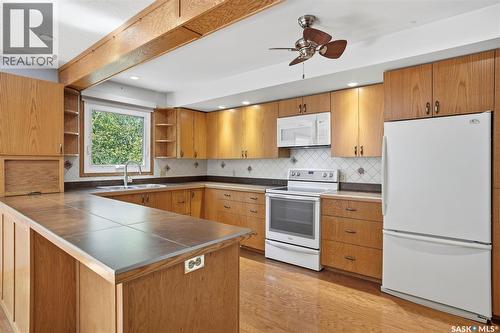 818 Pukwana Drive, Manitou Beach, SK - Indoor Photo Showing Kitchen With Double Sink