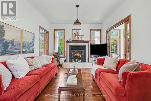 3 Kimini Drive, Ottawa, ON - Indoor Photo Showing Living Room With Fireplace