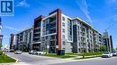 Contemporary multi-story building featuring stone veneer and paneling - 101 Shoreview Place Unit# 631, Stoney Creek, ON  - Outdoor With Balcony With Facade 