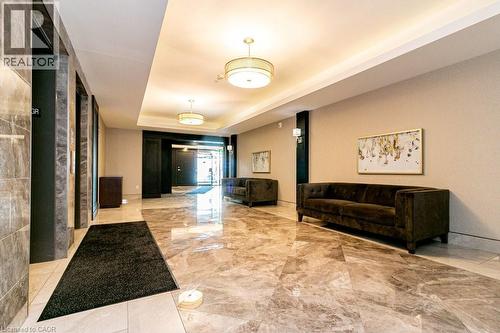 Spacious foyer featuring polished stone flooring, recessed lighting, and modern pendant fixtures - 101 Shoreview Place Unit# 631, Stoney Creek, ON - Indoor Photo Showing Other Room