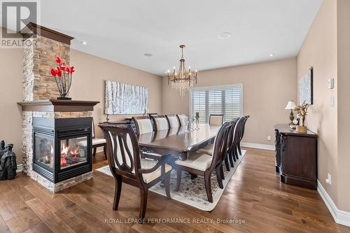 1453 Notre Dame Street, Russell, ON - Indoor Photo Showing Dining Room With Fireplace