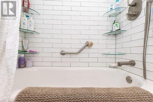 Main floor bathroom tub with subway tiles - 148 Gorham Road, Fort Erie (Ridgeway), ON - Indoor Photo Showing Bathroom