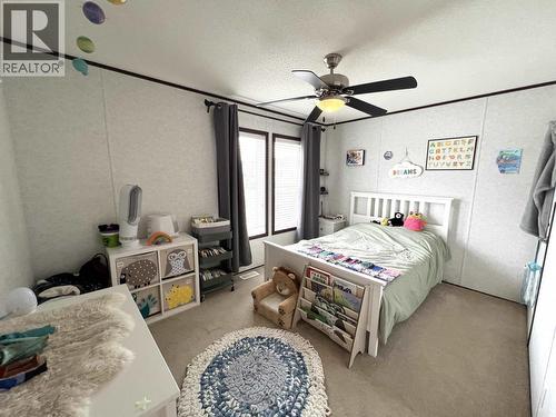 5506 Pine Crescent, Fort Nelson, BC - Indoor Photo Showing Bedroom
