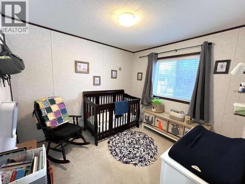 5506 Pine Crescent, Fort Nelson, BC - Indoor Photo Showing Bedroom