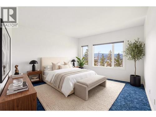 Primary bedroom- virtually staged with furniture - 448 Viewcrest Road, Kelowna, BC - Indoor Photo Showing Bedroom
