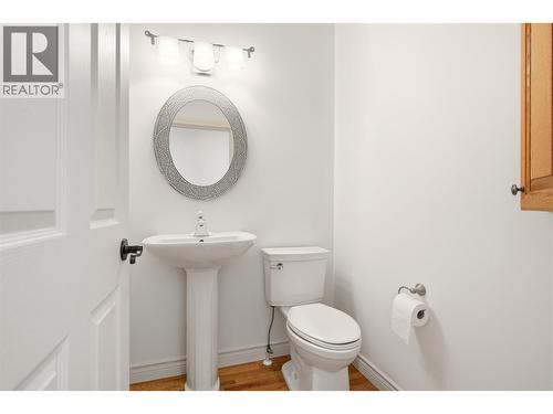 Powder room- main floor - 448 Viewcrest Road, Kelowna, BC - Indoor Photo Showing Bathroom