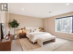 Lower level bedroom 2 with virtually staged furniture - 
