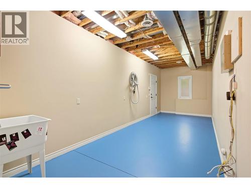 Lower level laundry room with separate entrance (currently a sink only) - 448 Viewcrest Road, Kelowna, BC - Indoor Photo Showing Other Room