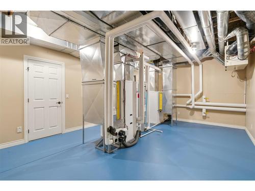 Spacious utility room with geothermal heating and cooling - 448 Viewcrest Road, Kelowna, BC - Indoor Photo Showing Basement