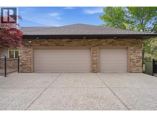 Spacious driveway with triple car garage - 448 Viewcrest Road, Kelowna, BC - Outdoor With Exterior