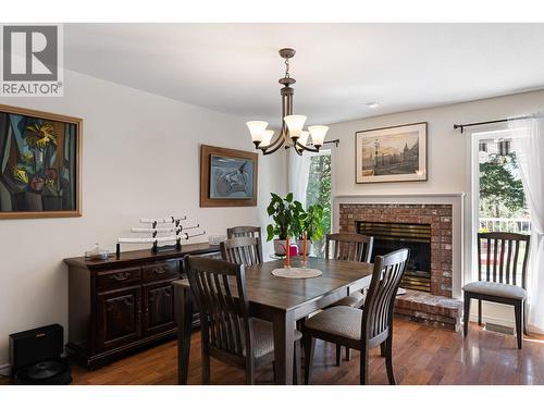 2211 Shannon Woods Place, West Kelowna, BC - Indoor Photo Showing Dining Room With Fireplace