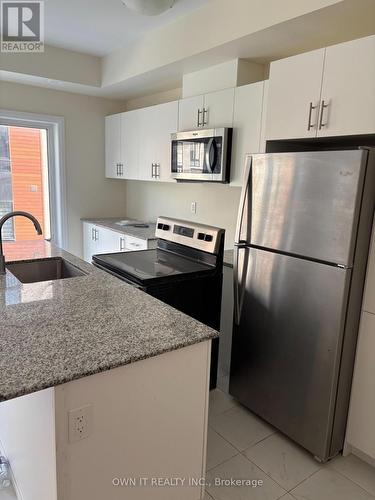 12 - 25 Priya Lane, Toronto, ON - Indoor Photo Showing Kitchen