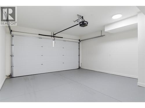 Attached double garage - 4601 97 Street Unit# 6, Osoyoos, BC - Indoor Photo Showing Garage