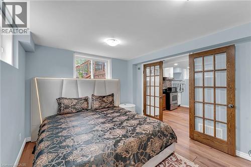 Bedroom with light blue walls and wood-finish flooring - 139 Ferris Drive, Wellesley, ON - Indoor Photo Showing Bedroom