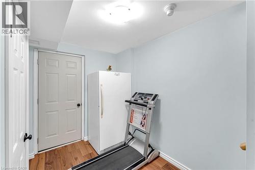 Interior room featuring wood-finish flooring and light blue wall tones - 139 Ferris Drive, Wellesley, ON - Indoor Photo Showing Other Room