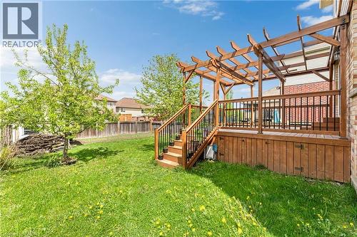 Expansive backyard featuring a multi-level wood deck, decorative pergola, and mature trees - 139 Ferris Drive, Wellesley, ON - Outdoor With Deck Patio Veranda
