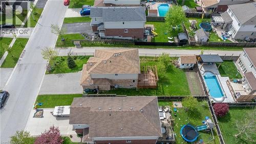 Aerial perspective showcasing a residential property with a multi-level deck, a verdant lawn, and a mature tree - 139 Ferris Drive, Wellesley, ON - Outdoor With View