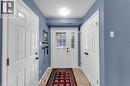 Entryway featuring a white paneled door, a sidelight with muntins, and a complementary white paneled closet door - 139 Ferris Drive, Wellesley, ON  - Indoor Photo Showing Other Room 