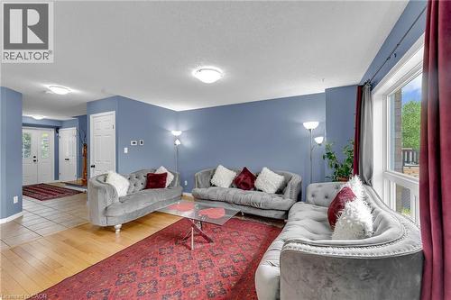 Spacious living area featuring light wood-finish flooring and a large window - 139 Ferris Drive, Wellesley, ON - Indoor Photo Showing Living Room
