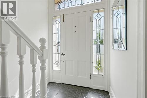 Entryway featuring a white paneled door with decorative leaded glass sidelights and transom window - 314 Hess Street S, Hamilton, ON - Indoor Photo Showing Other Room
