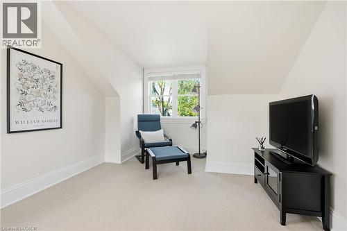 Carpeted room with sloped ceilings, white baseboards, and a double-hung window - 314 Hess Street S, Hamilton, ON - Indoor Photo Showing Other Room