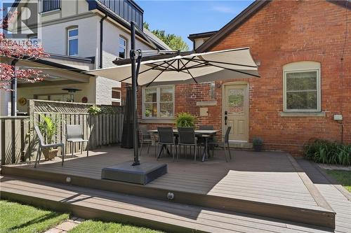 Multi-level composite deck with integrated lighting, offering distinct outdoor areas - 314 Hess Street S, Hamilton, ON - Outdoor With Exterior