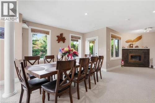 119 Gerber Meadows Drive, Wellesley, ON - Indoor Photo Showing Dining Room With Fireplace