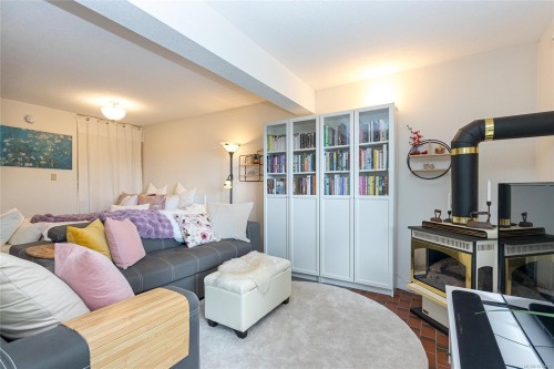 #411-2022 Foul Bay Rd, Victoria, BC - Indoor Photo Showing Living Room With Fireplace