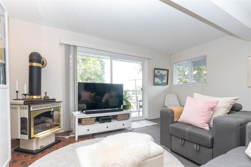#411-2022 Foul Bay Rd, Victoria, BC - Indoor Photo Showing Living Room With Fireplace