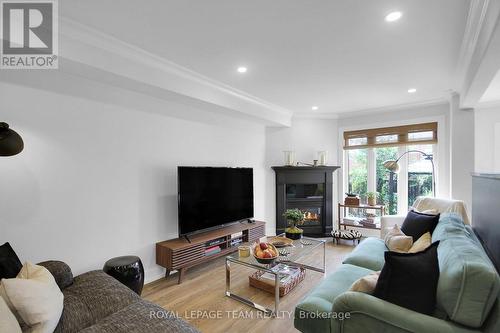112 Talltree Crescent, Ottawa, ON - Indoor Photo Showing Living Room With Fireplace