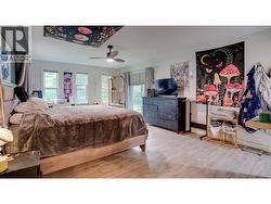 Master Bedroom Main Level with Ensuite, Walk-in Closet, and side yard access. - 