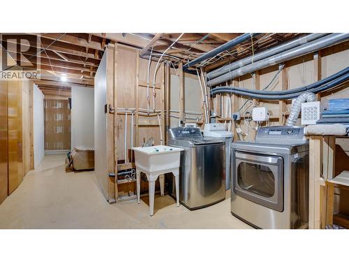 Downstairs Laundry Room and  Storage area - 2025 Catt Avenue, Lumby, BC - Indoor Photo Showing Laundry Room