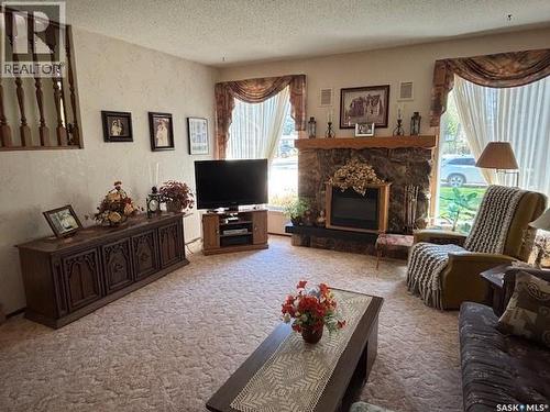 149 Garvin Crescent, Canora, SK - Indoor Photo Showing Living Room With Fireplace
