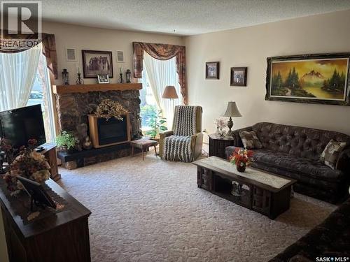 149 Garvin Crescent, Canora, SK - Indoor Photo Showing Living Room With Fireplace
