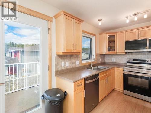 15 Bailey Place, Whitehorse, YT - Indoor Photo Showing Kitchen With Double Sink