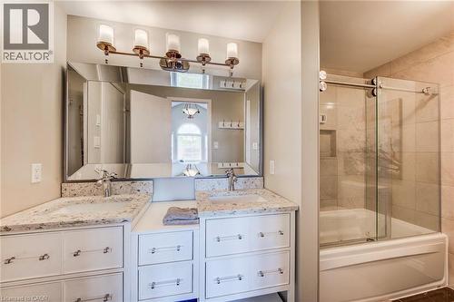 Dual vanity with undermount sinks and light-toned countertops - 702 Elgin Street N, Cambridge, ON - Indoor Photo Showing Bathroom