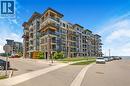 Contemporary multi-story building featuring brick and panel siding - 10 Esplanade Lane Unit# 310, Grimsby, ON  - Outdoor With Facade 