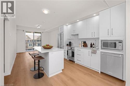 Virtually-staged photos - 10 Esplanade Lane Unit# 310, Grimsby, ON - Indoor Photo Showing Kitchen With Upgraded Kitchen