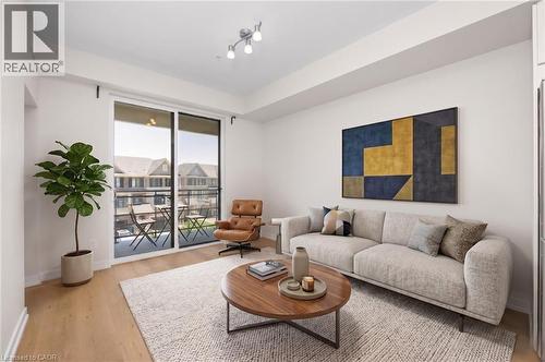 Virtually-staged photos - 10 Esplanade Lane Unit# 310, Grimsby, ON - Indoor Photo Showing Living Room