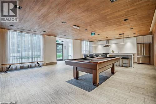Recreation room featuring a pool table, wood-finish ceiling, and light-toned tile flooring - 10 Esplanade Lane Unit# 310, Grimsby, ON - Indoor Photo Showing Other Room