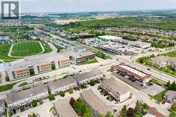 Aerial landscape showcasing a mixed-use residential and commercial district - 