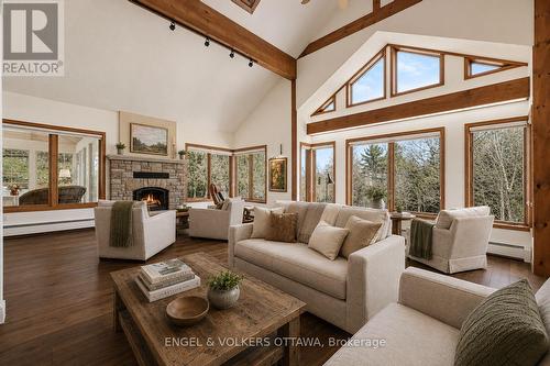 Virtually staged with hardwood (estimate on file) - 4637 Northwoods Drive, Ottawa, ON - Indoor Photo Showing Living Room With Fireplace