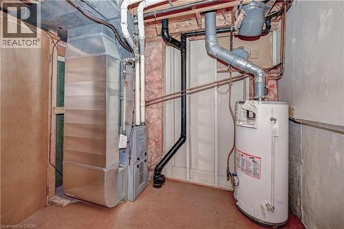 Dedicated utility space featuring a furnace and water heater - 92 Pinemeadow Crescent, Waterloo, ON - Indoor Photo Showing Basement