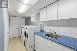 Spacious laundry room with tons of storage. - 